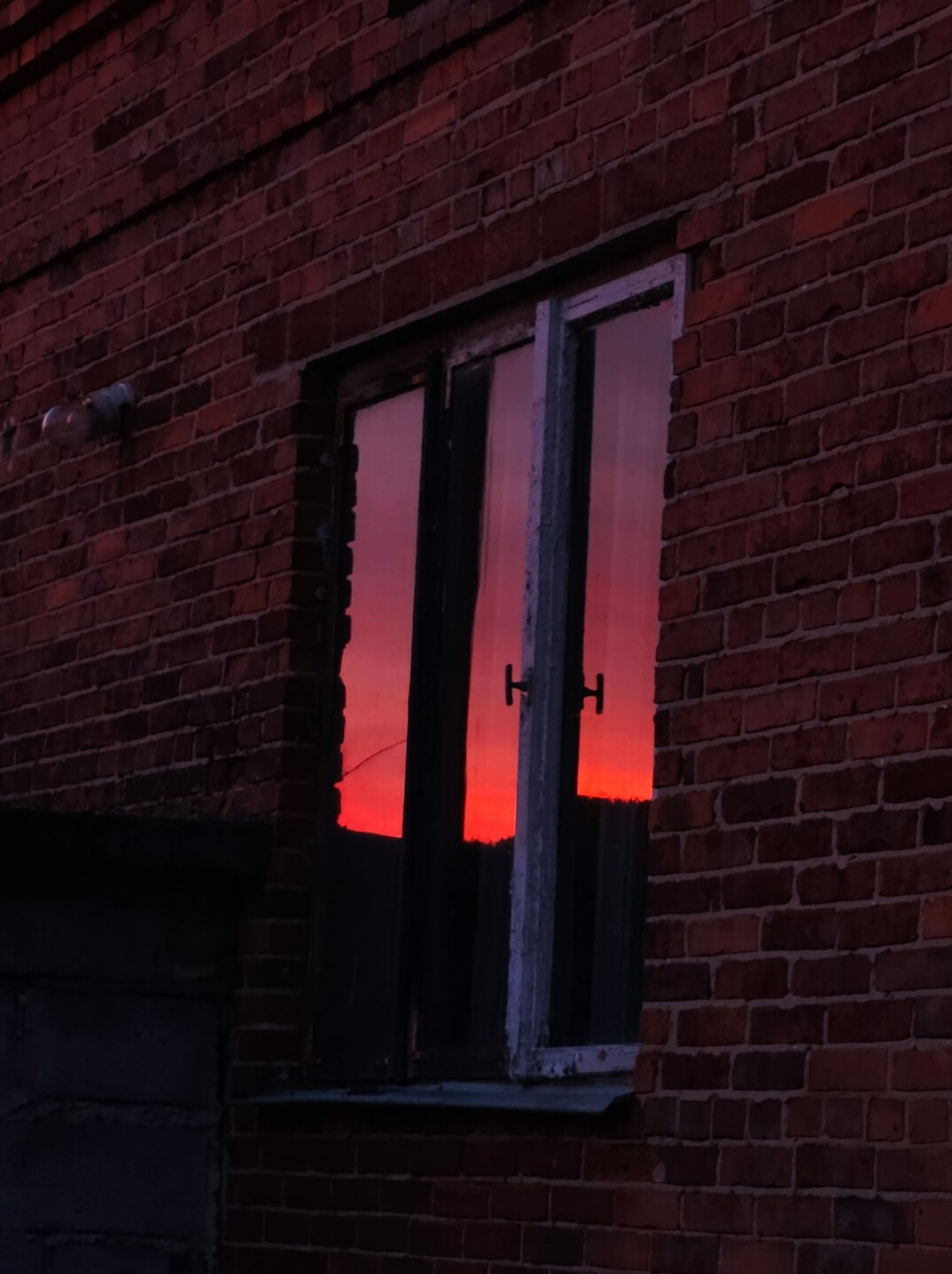 evening reflection by window