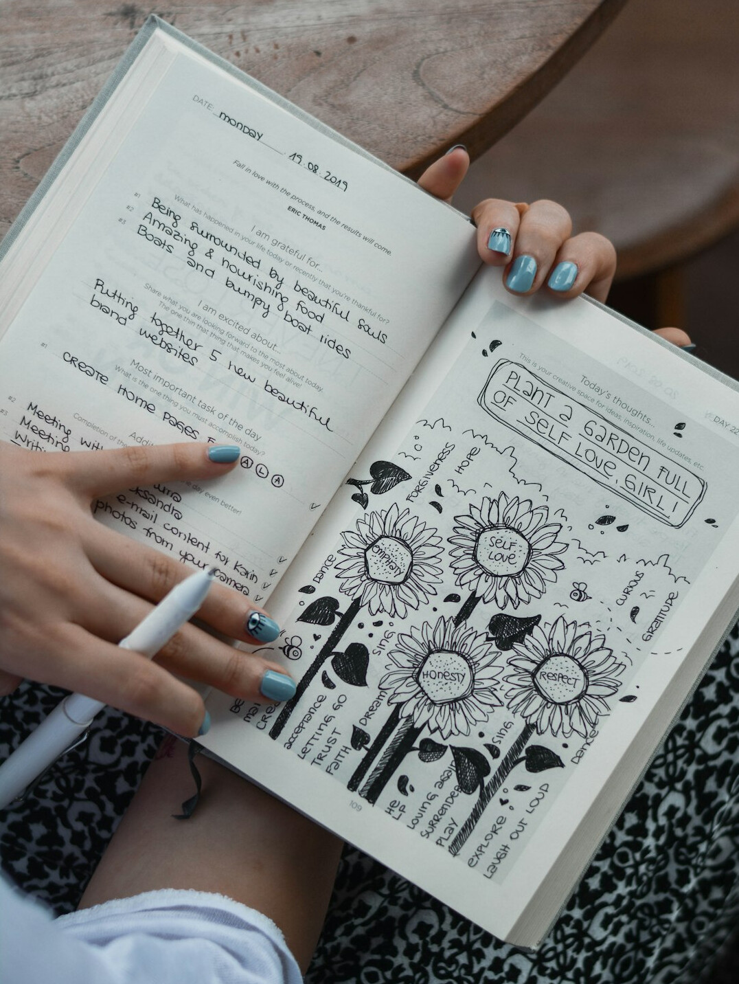person writing in gratitude journal