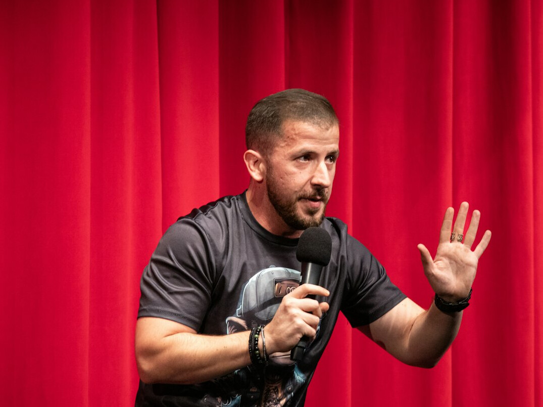 person speaking confidently on stage